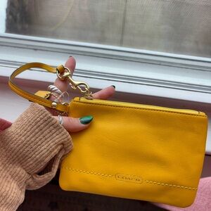 Mustard coach wristlet